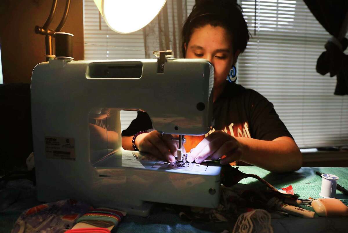 Sarah Estrada, a 19-year-old freshman at Art Institute of Chicago is home making masks for donations, on Friday, April 3, 2020.