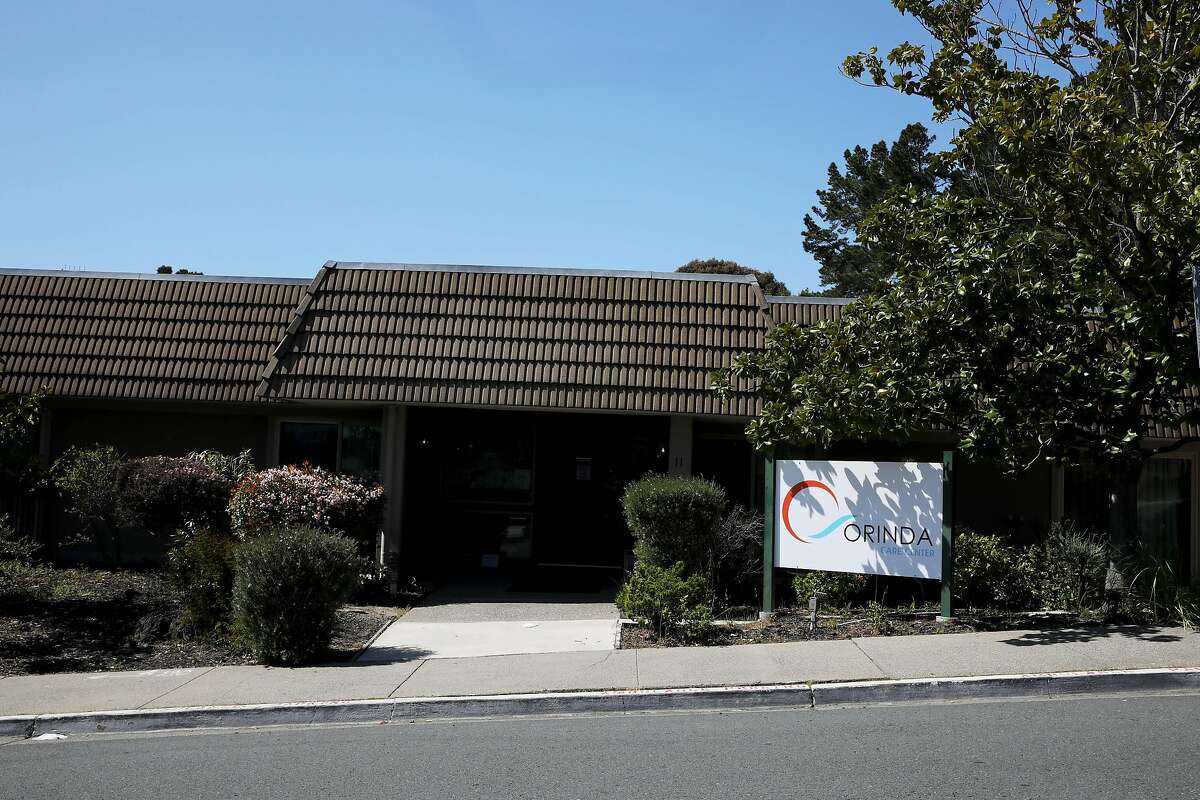 Exterior of the Orinda Care Center, located at 11 Altarinda Rd., on Friday, April 3, 2020, in Orinda, Calif. Contra Costa officials release more info on outbreak at nursing facility, launch investigations into two more facilities: At least 27 people who live or work at a 45-resident nursing facility in Orinda have tested positive for the coronavirus, health officials said Friday as they launched investigations and started testing at two other senior care facilities in the county. Officials started investigating the Orinda Care Center this week when two staffers sought sought medical care, according to the county Health Services. The two staffers and two patients tested positive on Wednesday. County health officials tested all patients and staff Thursday, they said, and confirmed 24 patients and three staffers had the virus. They are still awaiting some test results. Two of the residents are being treated at hospitals. As of Friday morning, no staffers or patients had died of the virus. Staffers and residents who do not have serious symptoms are medically isolated but not hospitalized, officials said. "The situation is very serious, and we are deeply concerned about residents of our senior care facilities in Contra Costa County," said Dr. Chris Farnitano, the county's health officer. "That is why we need everyone to follow the stay-at-home order, social distancing guidance and other measures in recent health orders ? to protect the people in our community who are vulnerable to severe illness from COVID-19."