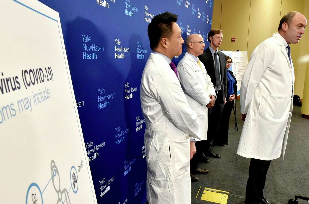 New Haven, Connecticut - Friday, March 13, 2020: Dr. Thomas Balcezak, MD, Yale New Haven Health Chief Medical Officer, right, speaks during a Yale New Haven Health press conference updating the pubic on its preparations on dealing with COVID-19 / Cornavirus. With Balcezak from left to right, rear, are Dr. Steven Choi, MD, Chief Quality Officer at Yale New Haven Health and Yale school of Medicine, Dr. Rick Martinello, MD, Medical Director of Infection Prevention at Yale New Haven Health, New Haven Mayor Justin Elicker, and Maritza Bond, New Haven Director of Public Health.