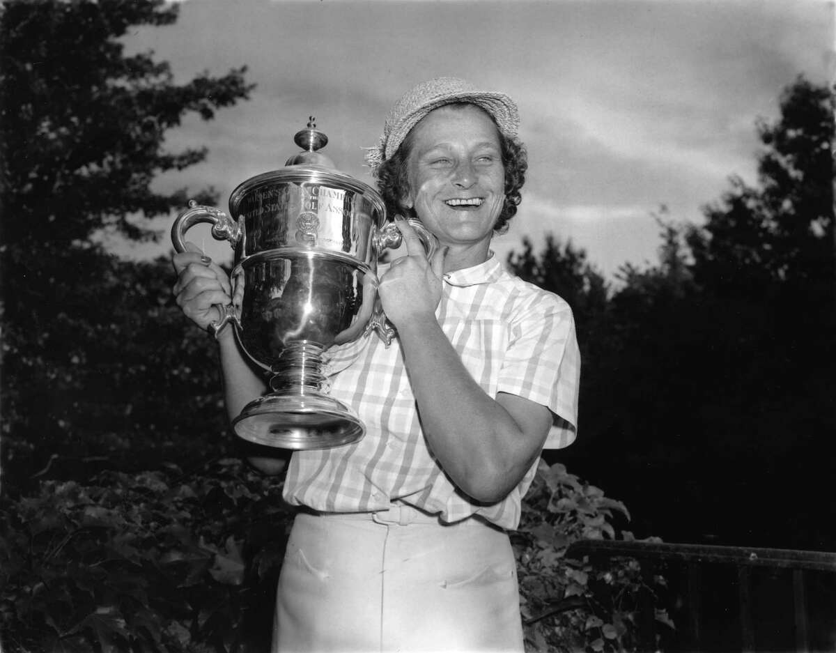 ** ADVANCE FOR WEEKEND EDITIONS MAY 17 18 * Babe Didrikson Zaharias smiles as she holds her Women's U.S. Open Golf Championship trophy cup at Salem Country Club in Peabody, Ma., July 3, 1954. Zaharias' name has come up often lately because she's the last woman to tee it up with men at a PGA event, doing so in the 1945 Los Angeles Open. She got in by qualifying, made the 36-hole cut and was eliminated the next day with a 79.