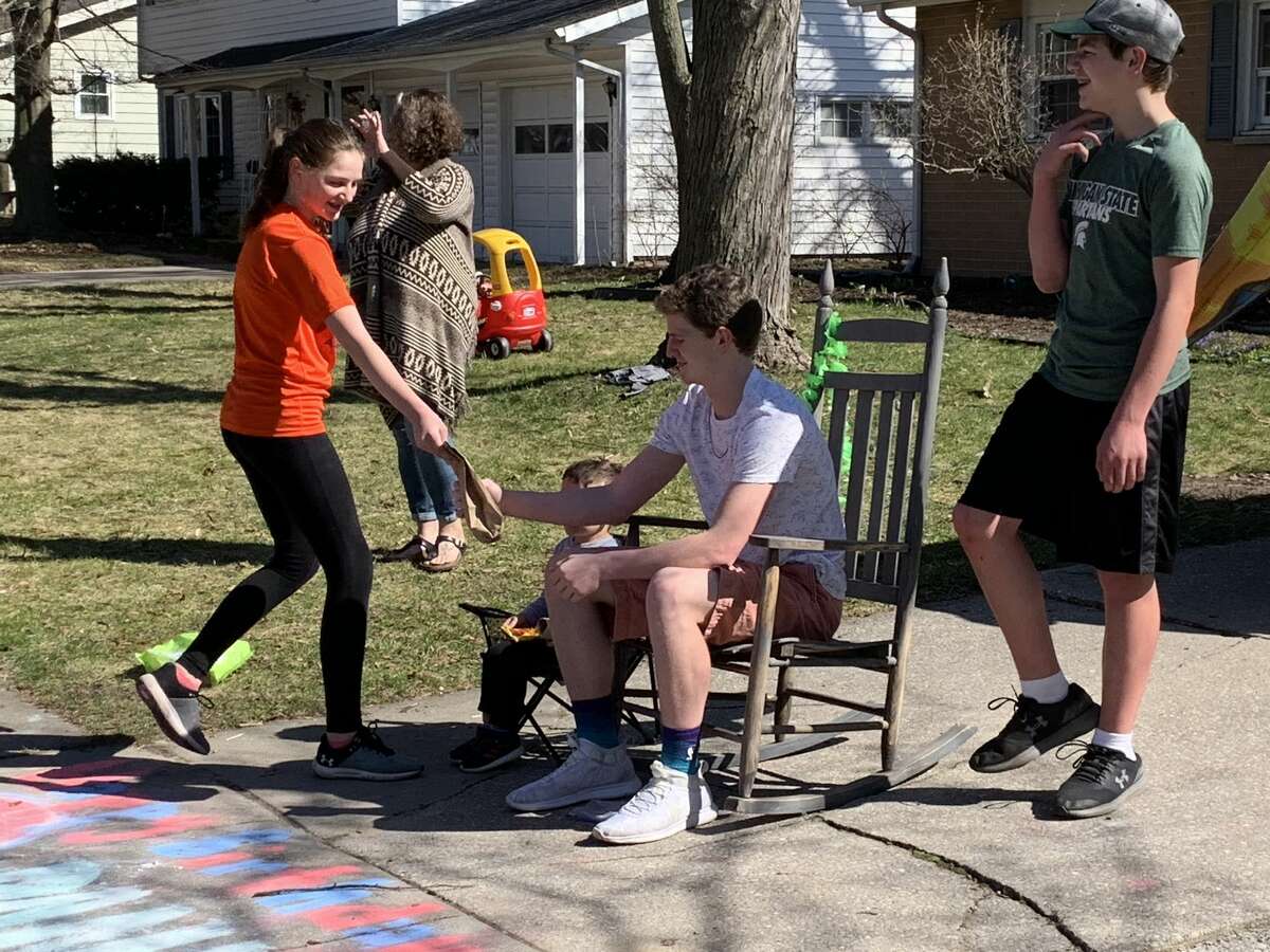 Scenes from Danny TerBurgh's 16th birthday "parade" on Love Street in Midland on Sunday afternoon, April 5, 2020. Well-wishers drove past the TerBurgh household and treated Danny to oodles of candy, some toilet paper, a couple of brand new basketballs, and even an impressive tire burnout.