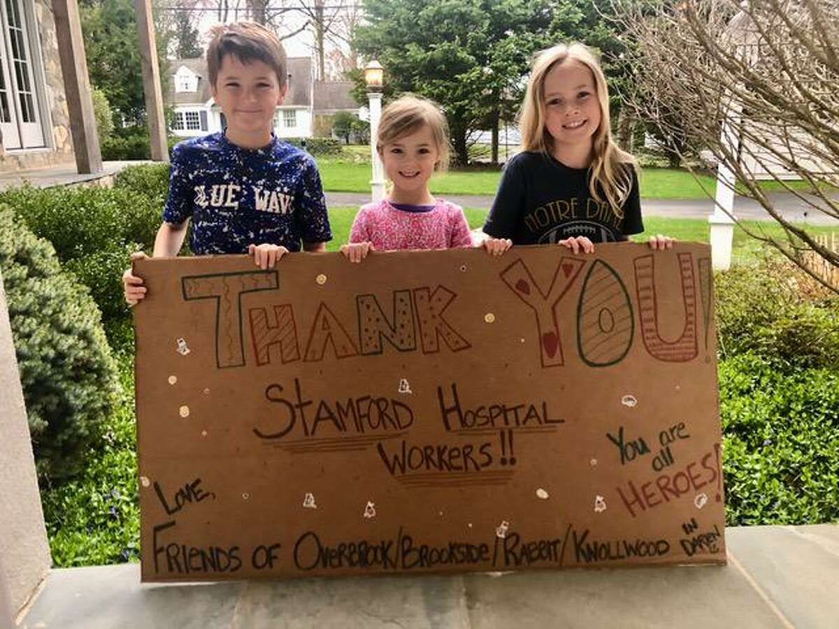 You're our hero! Neighbors surprise Darien nurse with messages of