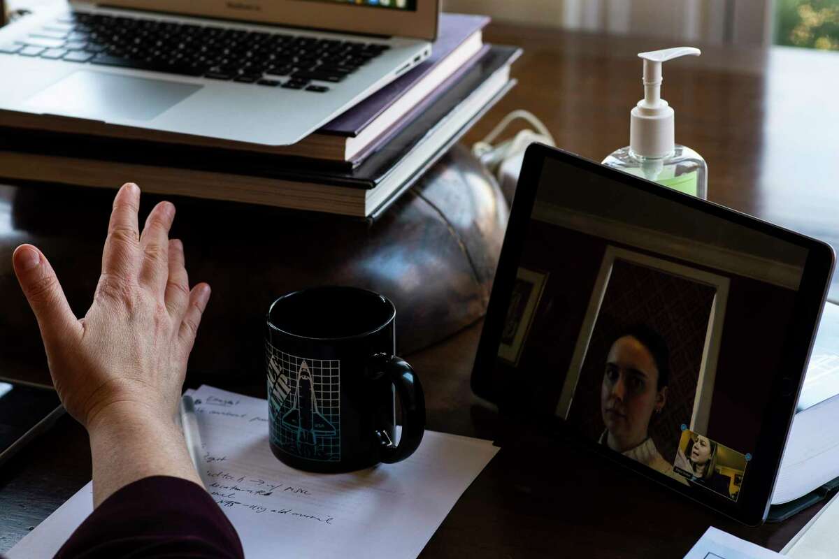 Slotkin on a call with a bio solutions company in her home.