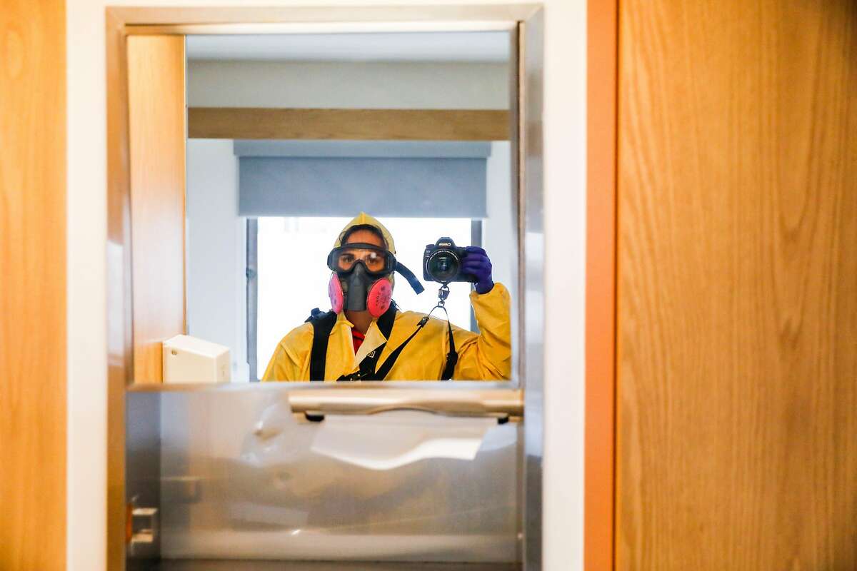 Photographer Gabrielle Lurie takes a selfie in full PPE gear on the Covid-19 floor at Saint Francis Hospital in San Francisco on Monday, April 6, 2020.
