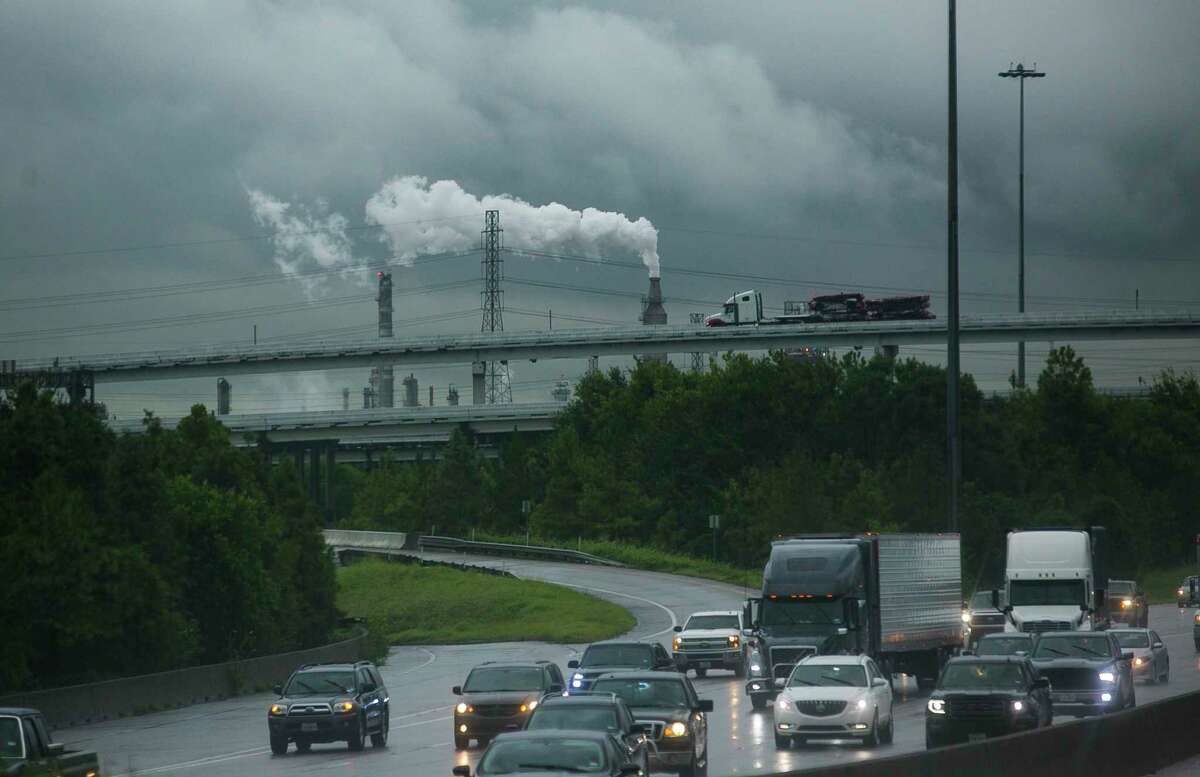 Traffic rolls down 610 East past refineries in east Houston, Tuesday, Sept. 17, 2019. Climate scientists used two different scenarios to forecast climate impacts on the Houston region, one with no change in reliance on fossil fuels, and one with a transition toward renewable energy to reduce emissions, in accord with the Paris Agreement. Many cities including Houston have signed on to independently to the Paris Agreement climate goals despite of the U.S.’s withdrawal.
