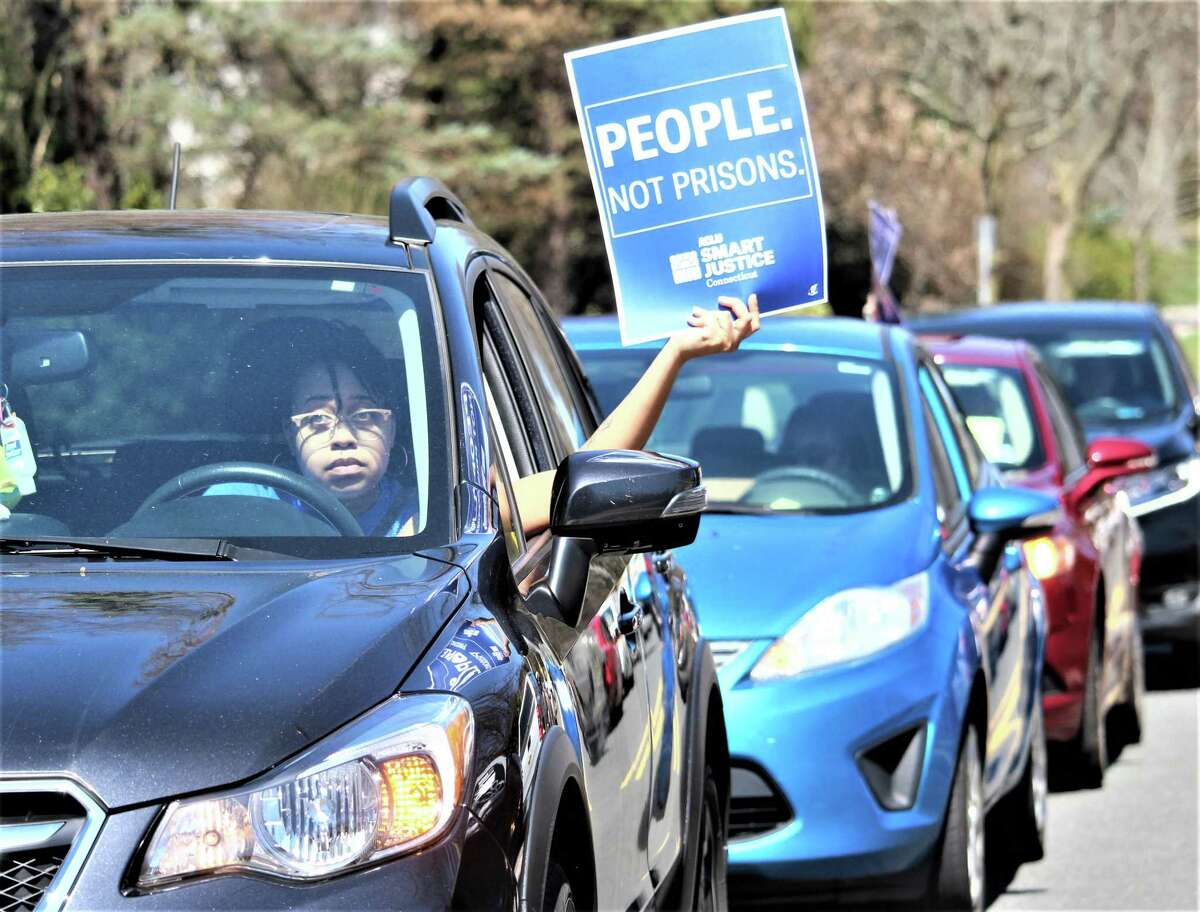 More than 50 cars gathered in front of the governor's Executive Residence in Hartford earlier this year, as protesters for prison release in the coronavirus crisis remained in their cars and honked, stopping traffic for about an hour. Advocates are calling on the state to begin commuting prison sentences again.