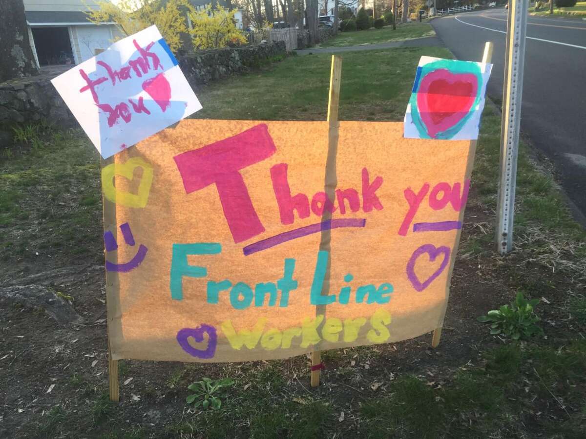 A sign is on display on the corner of Springwood Road and Main Street giving thanks to front line workers.