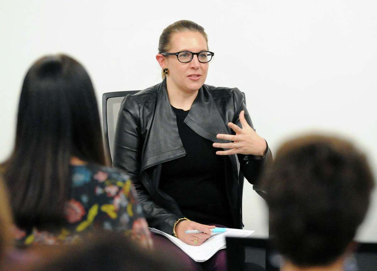 Kate Farrar, executive director of the Connecticut Women's Education and Legal Fund, makes a point as she leads a discussion on pay equity for women after the screening of the film "Battle of the Sexes” in Norwalk in 2018.