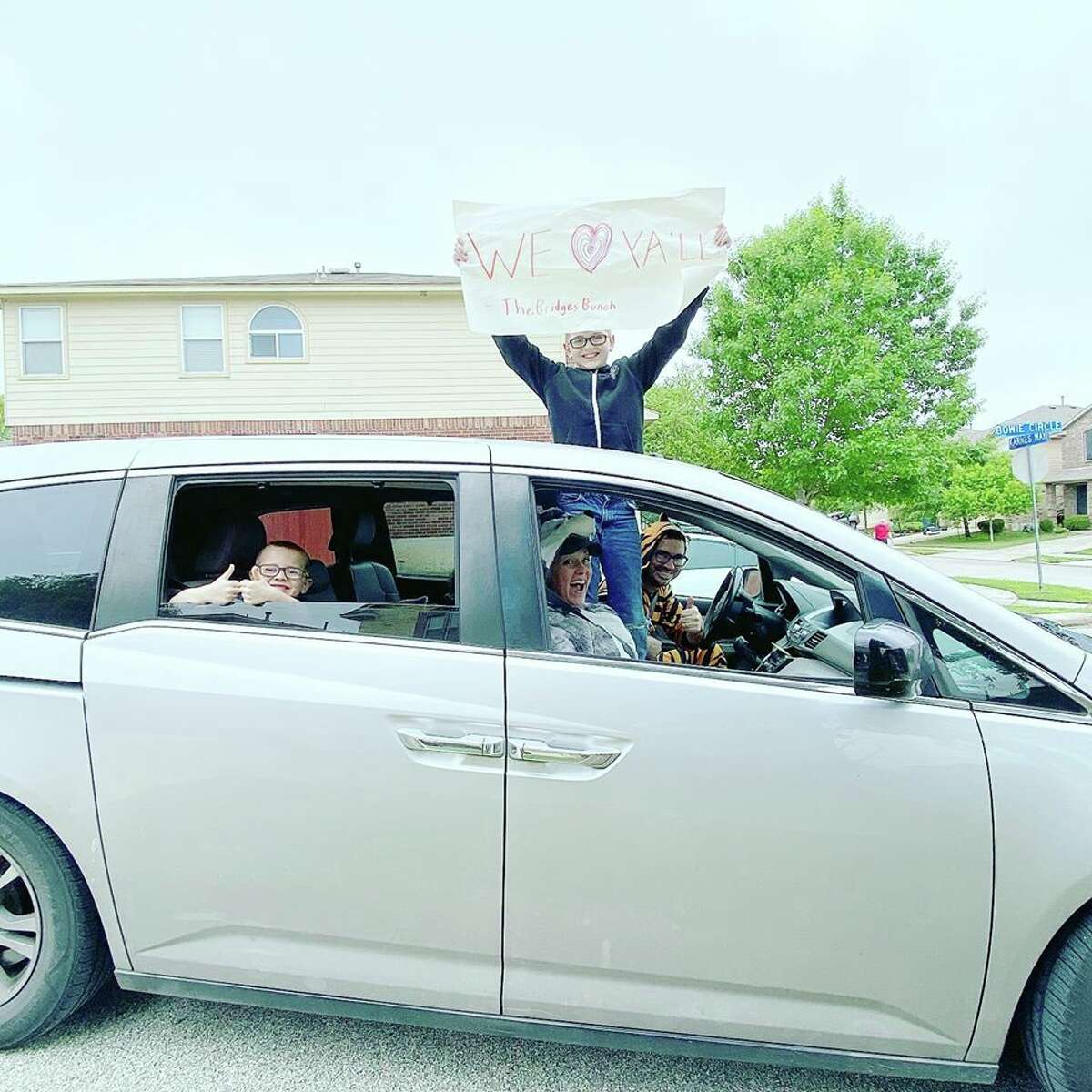 While blasting "We Like to Party!" by Vengaboys, a San Antonio family dressed up in funny costumes and drove around for two hours Sunday morning to throw bean and cheese tacos to teenagers from their youth group.