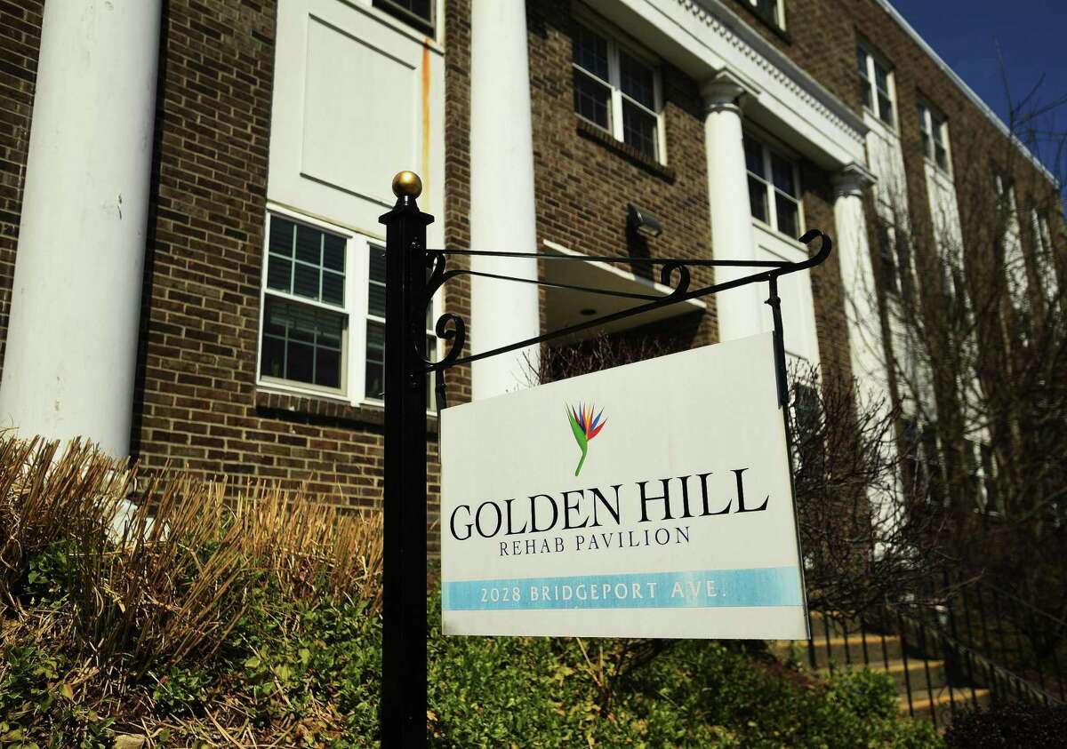 File photo showing a sign outside the Golden Hill Rehab Pavilion nursing home at 2028 Bridgeport Avenue in Milford, Conn., taken on Tuesday, April 7, 2020. The facility has 82 residents with lab-confirmed cases of COVID-19. The facility also reported 24 confirmed and probable deaths linked to the virus.