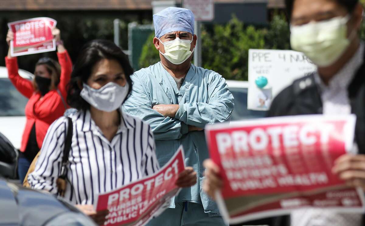 ORANGE, CALIFORNIA - APRIL 03: Nurses and supporters protest about the lack of personal protective gear available at UCI Medical Center amid the coronavirus pandemic on April 3, 2020 in Orange, California. Hospitals nationwide are facing shortages of PPE due to the COVID-19 outbreak. (Photo by Mario Tama/Getty Images)
