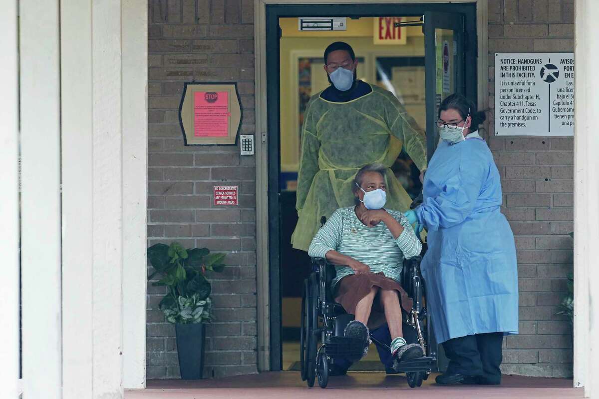 A resident is taken from the Southeast Nursing and Rehabilitation Center by a private ambulance in April. The state should release basic data for COVID-19 cases and deaths at nursing homes.