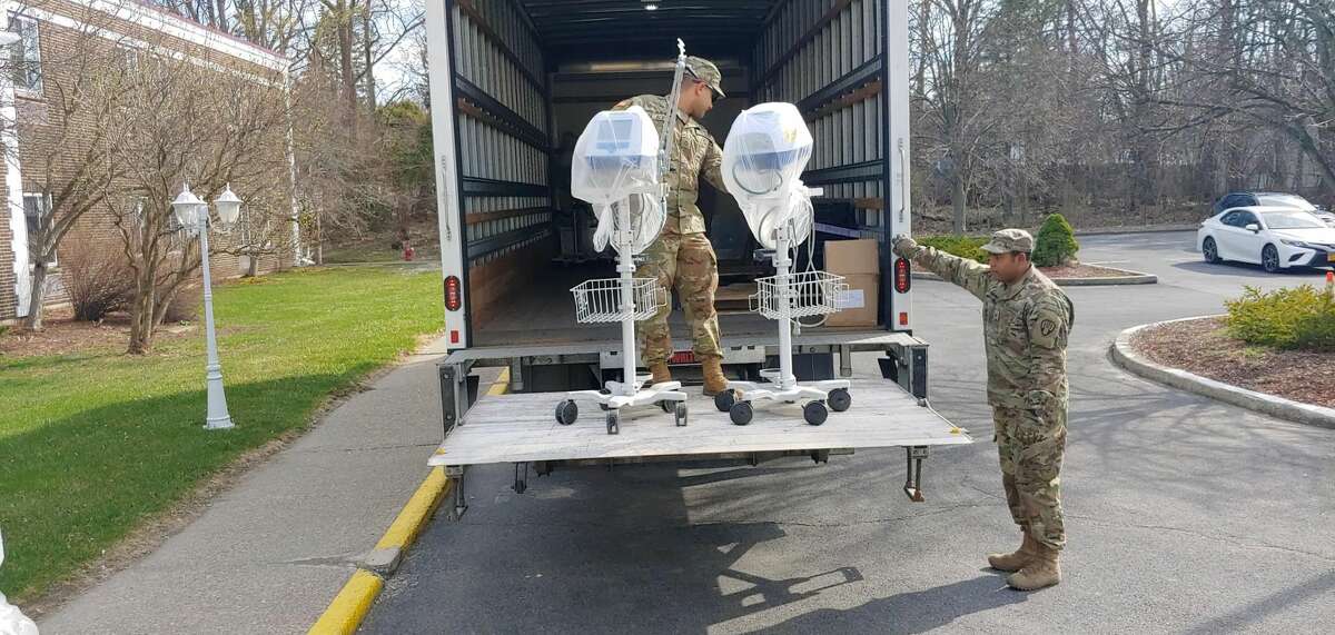 Members of the National Guard load ventilators from Pathways Nursing and Rehabilitation Center in Niskayuna on April 7, 2020.