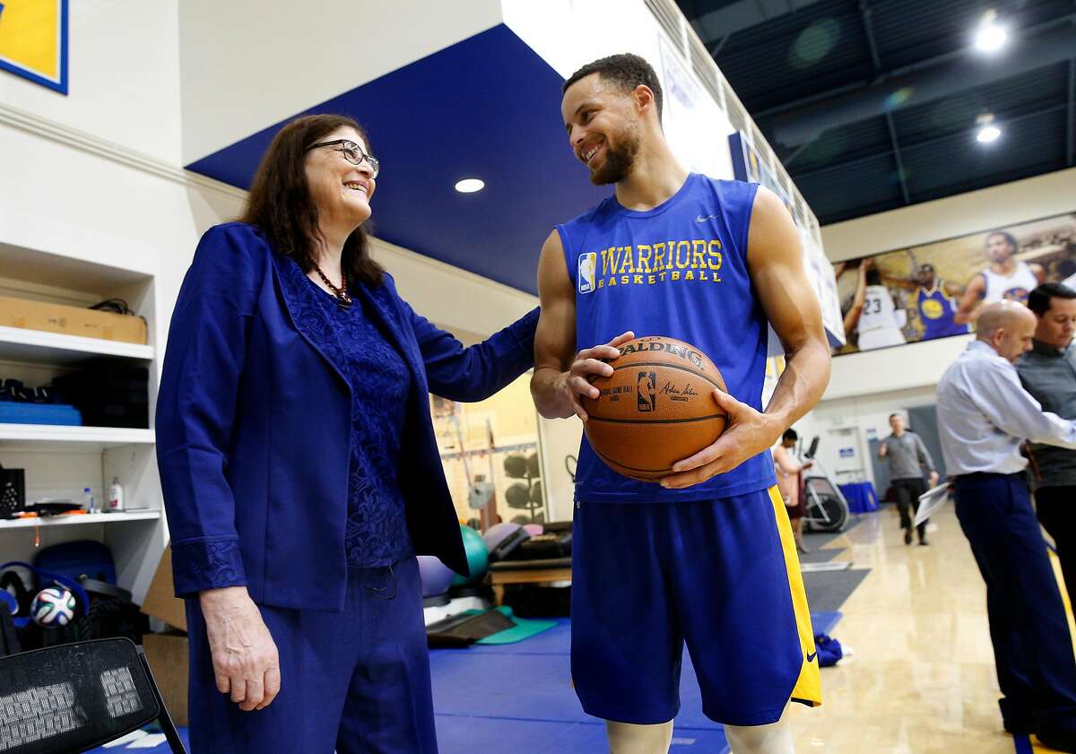 Denise Long visits with Stephen Curry during a recent Golden State Warriors' practice session. Long, after graduating from High School was drafted by the Golden State Warriors to play on their women's exhibition team. She got the chance to visit with players and see a Golden State Warriors' practice, on Thurs. March 8, 2018, in Oakland, Calif.