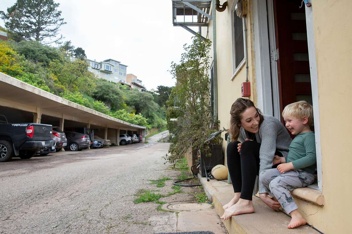 Izabel Arnold, 26, with her three-year-old son Arlo outside her home on Saturday, March 28, 2020, in San Francisco, Calif.