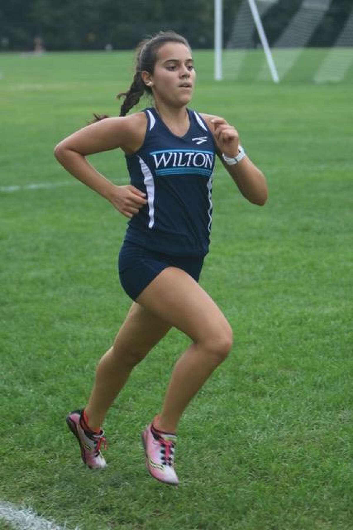 Paula Perez Pelaez runs a cross-country race for Wilton High School.