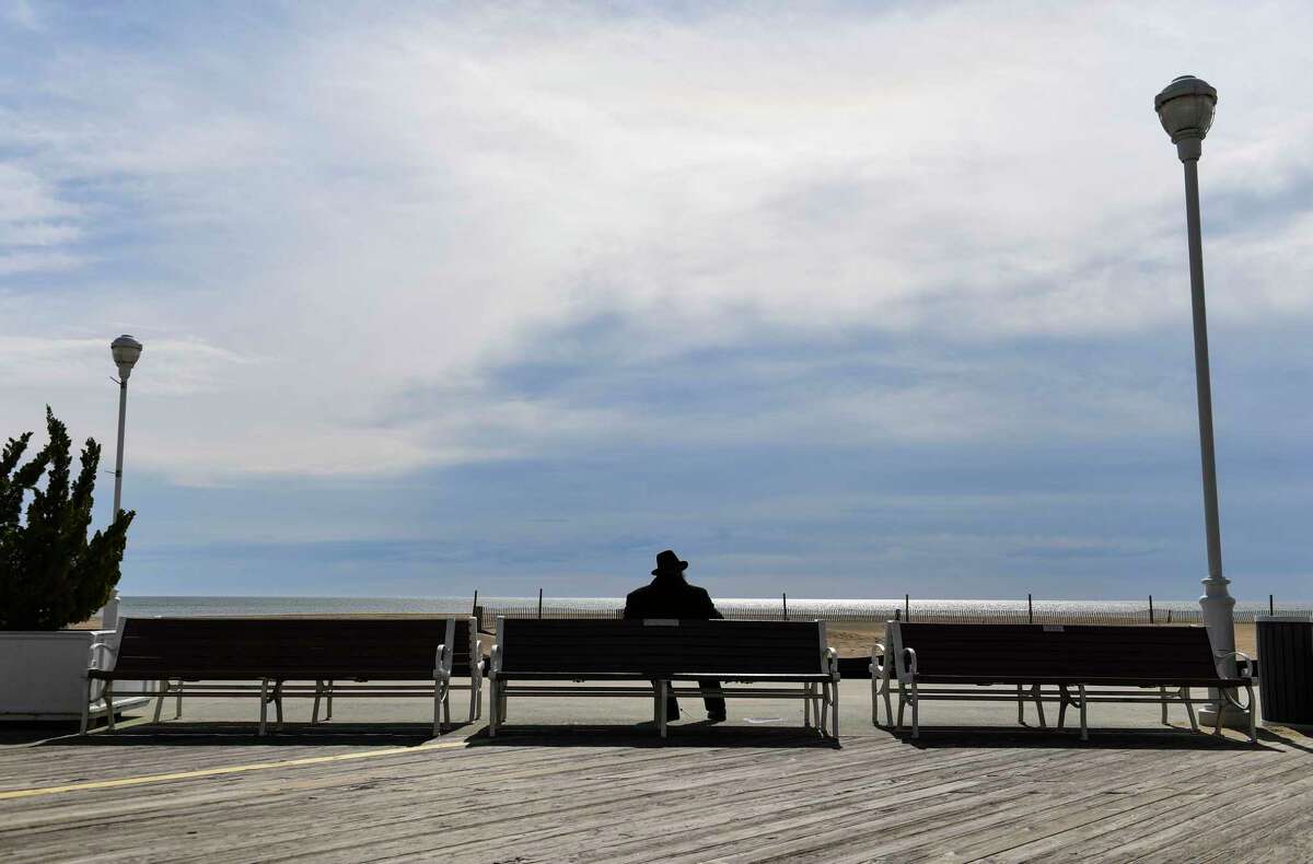 Stay-at-home orders have left popular spots such as the boardwalk in Ocean City, Md., largely deserted. Photographed April 8, 2020.