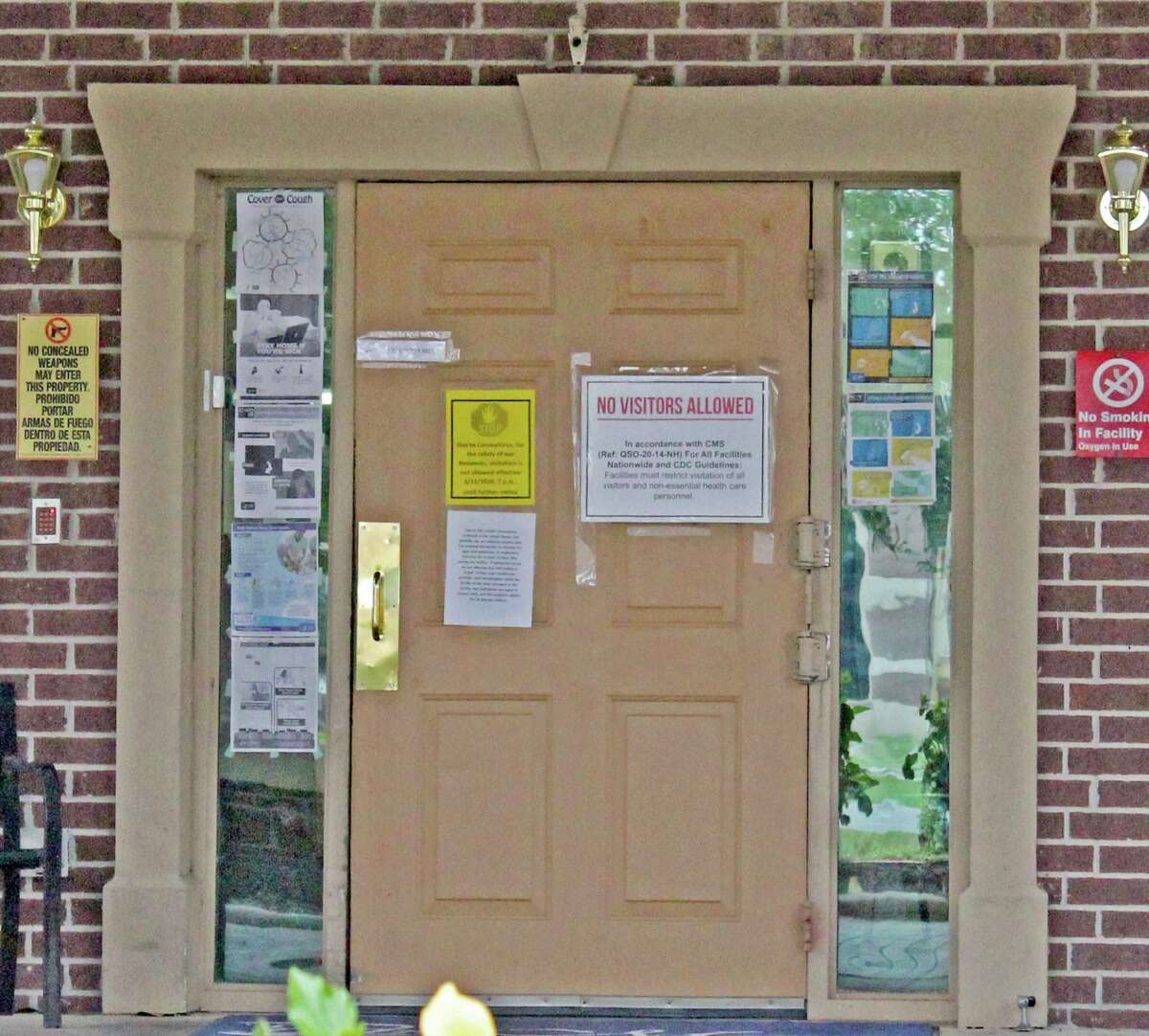 The front door of a Missouri City nursing home alerts visitors that no outsiders are allowed due to the COVID-19 health crisis.