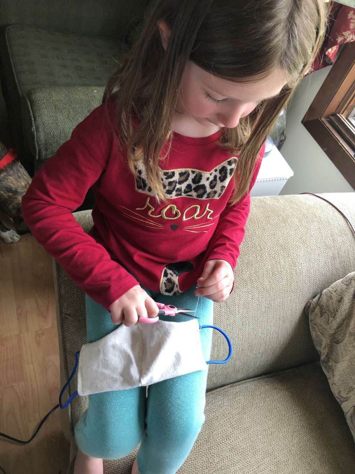 "We are always talking about kindness in our schools and the capacity of the human heart, said Trumbull resident Abbie Smith. She and her children are making and giving away masks for free to those in Trumbull. "This is our opportunity to give to our neighbors what we know how."