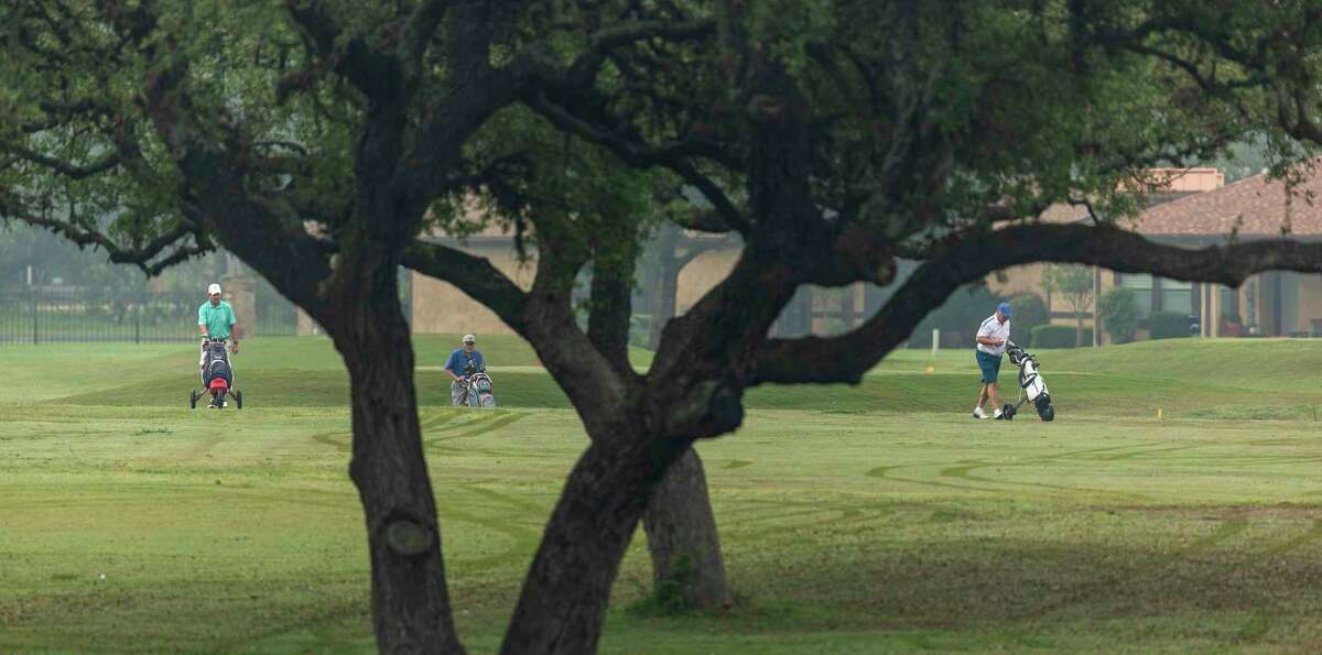 Golfers play Wednesday at the Alsatian Golf Club outside Castroville in Medina County. Only a few courses remained open within driving distance of San Antonio, which closed its courses last week. But local officials were under pressure from Gov. Greg Abbott to close them until he offered a compromise Thursday.