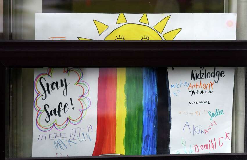 A message of hope is displayed in a window at the YMCA KidzLodge Early Learning Center on Thursday, April 9, 2020, in Clifton Park, N.Y. (Will Waldron/Times Union)