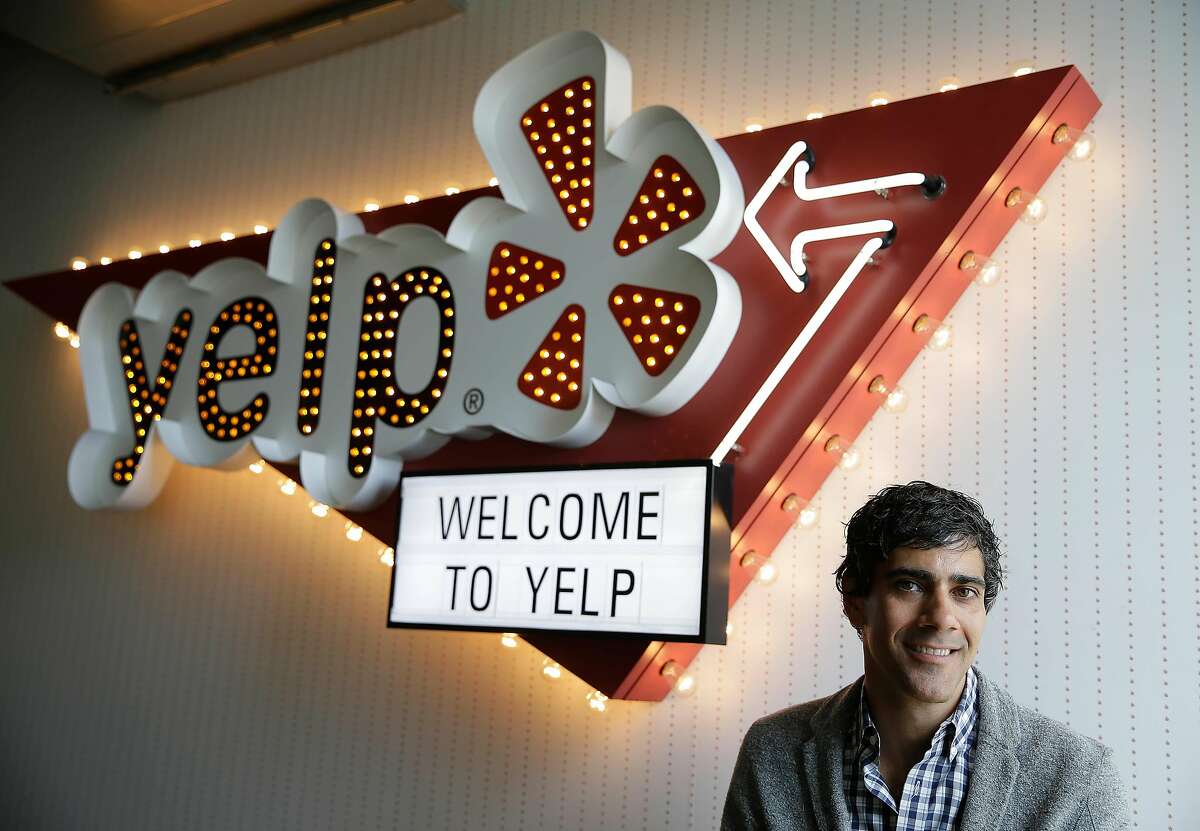In this photo taken Friday, Aug. 1, 2014, Yelp CEO Jeremy Stoppelman poses at his company's headquarters in San Francisco. Stoppelman, 36, probably wouldn’t be running Yelp Inc. if he had paid more attention to the opinions of outsiders than his own insights. (AP Photo/Eric Risberg)