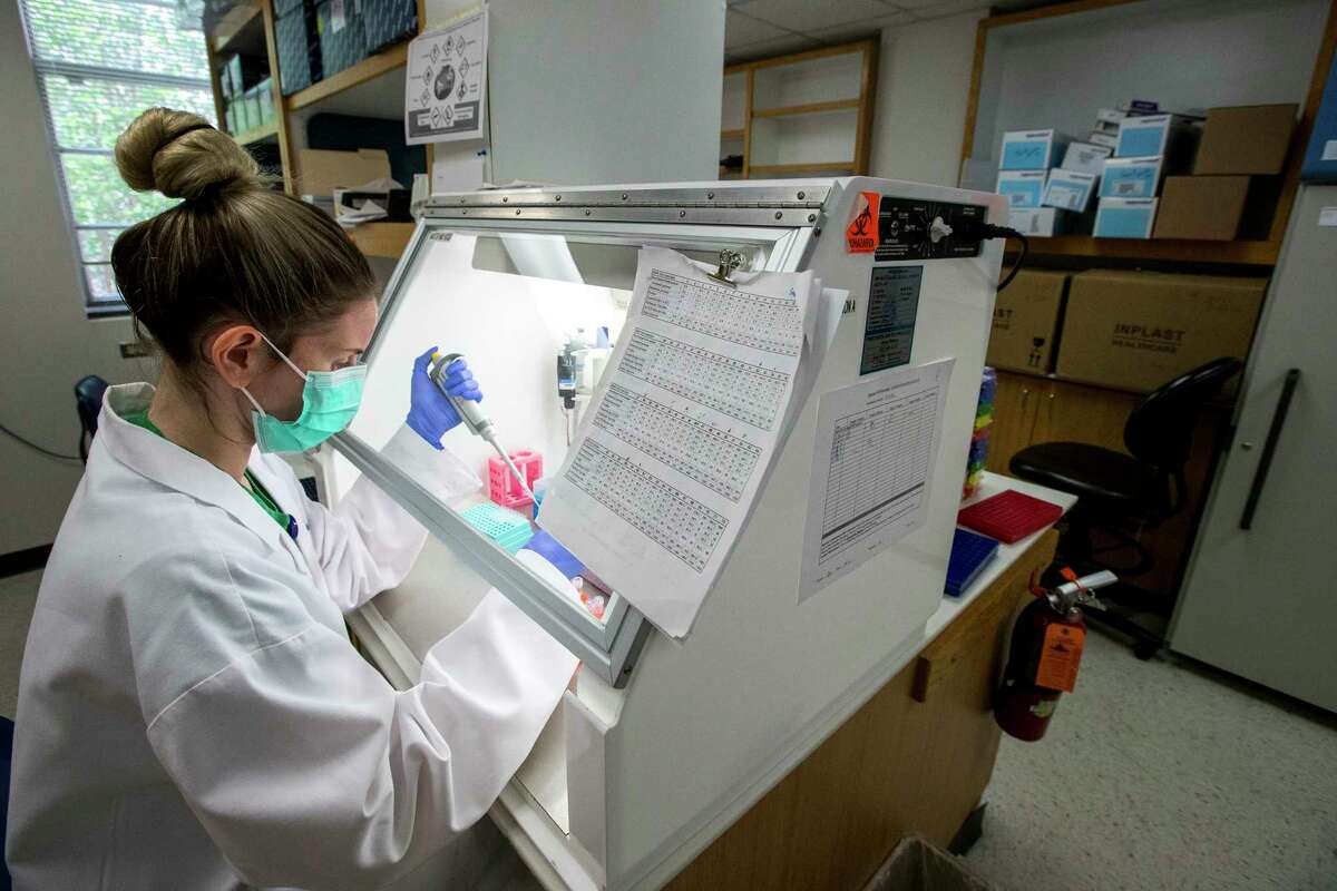 Ashlie Renner, research technician, prepares a Polymerase Chain Reaction tray while working in a lab on Thursday, April 9, 2020 at Baylor College of Medicine in Houston. BCM is working on an experimental therapy transfusing the blood plasma of people who’ve recovered from COVID-19 into patients fighting the disease. Baylor and the Gulf Coast Regional Blood Center are partnering to make the potentially therapeutic plasma available to hospitals that get the Food and Drug Administration’s permission to transfuse it into patients. Baylor will screen and test interested donors and the blood center will collect the plasma and get it to hospitals.