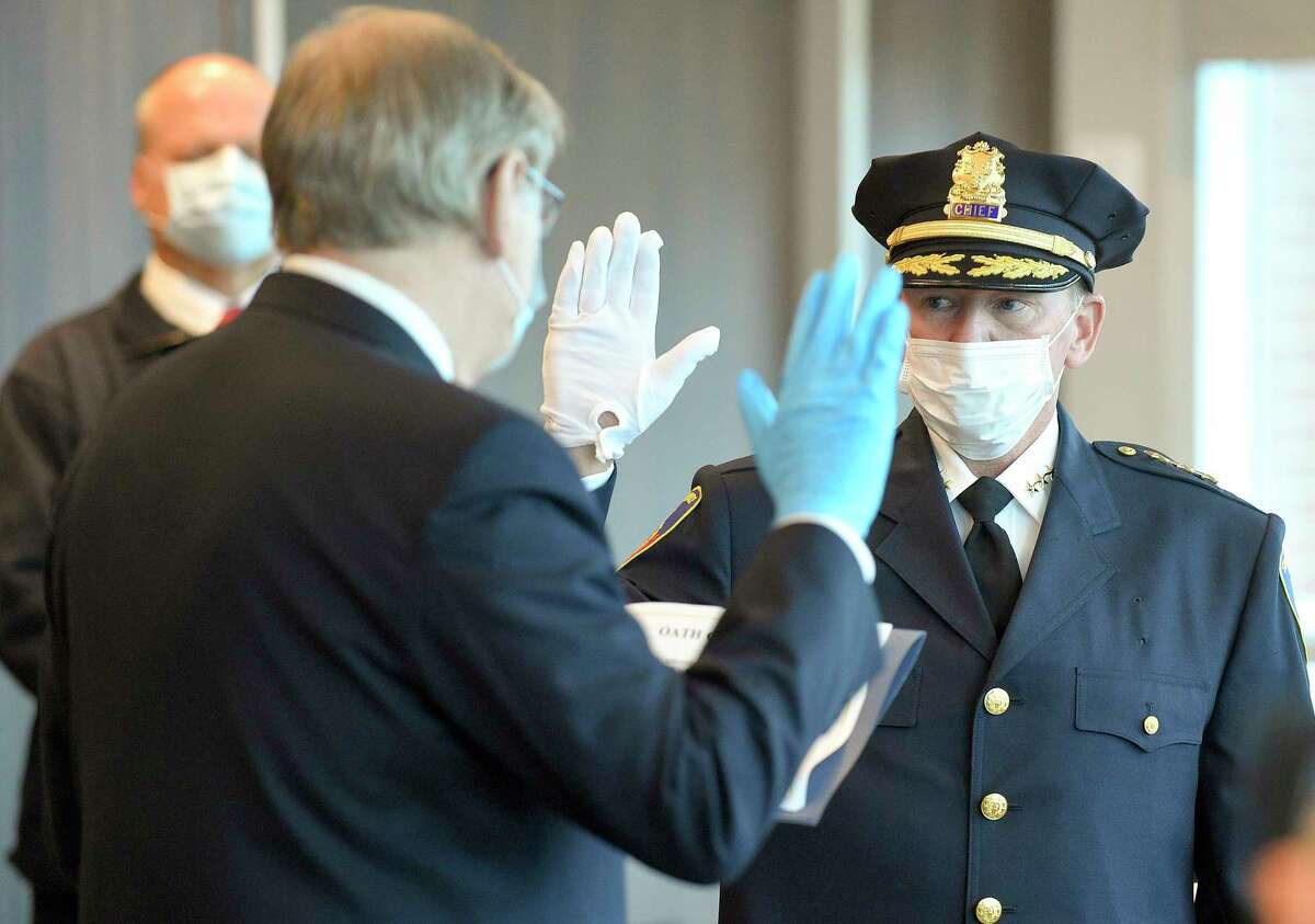 Former Easton Police Chief Tim Shaw is sworn in as Stamford's newest police chief by Mayor David Martin in a private ceremony at police headquarters on April 9, 2020 in Stamford, Connecticut. Shaw was joined by his family, wife Nancy, and his two children, daughter Taylor and son Ryan, along with a handful of officers and city officials in the community room.