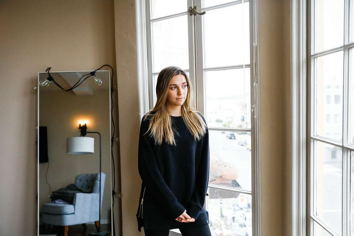 Phoebe McPherson who uses cannabis edibles as a way of dealing with shelter-in-place anxiety stands for a portrait in her apartment in San Francisco, California on Thursday, April 9, 2020.