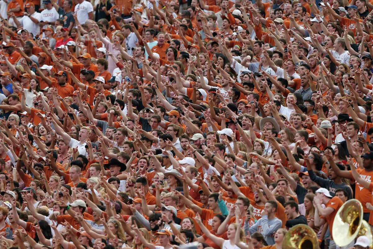 Texas Longhorns fans cheer in the second half against the TCU Horned Frogs at Darrell K Royal-Texas Memorial Stadium on September 22, 2018. The university announced this week that 13 football players had tested positive for the coronavirus.
