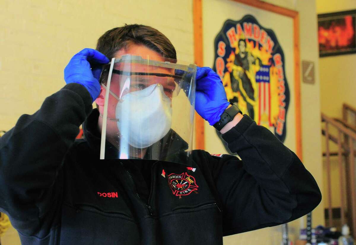 Hamden Public Schools personnel deliver 3D printed face shields for EMS workers at Hamden Fire Department's main fire station in Hamden, Conn., on Thursday Apr. 3, 2020.