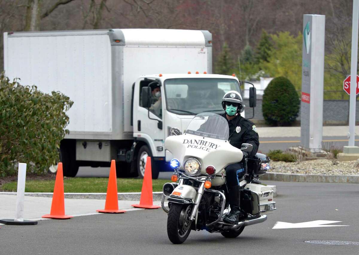 Ezra Zimmerman, of Ridgefield, owner of EZ Moving, is given a police escort to Danbury Hospital from I-84. Zimmerman volunteered to dive to Kentucky to pick up four used ventilators that Danbury Hospital had purchased. Tuesday, April 7, 2020, in Danbury, Conn.