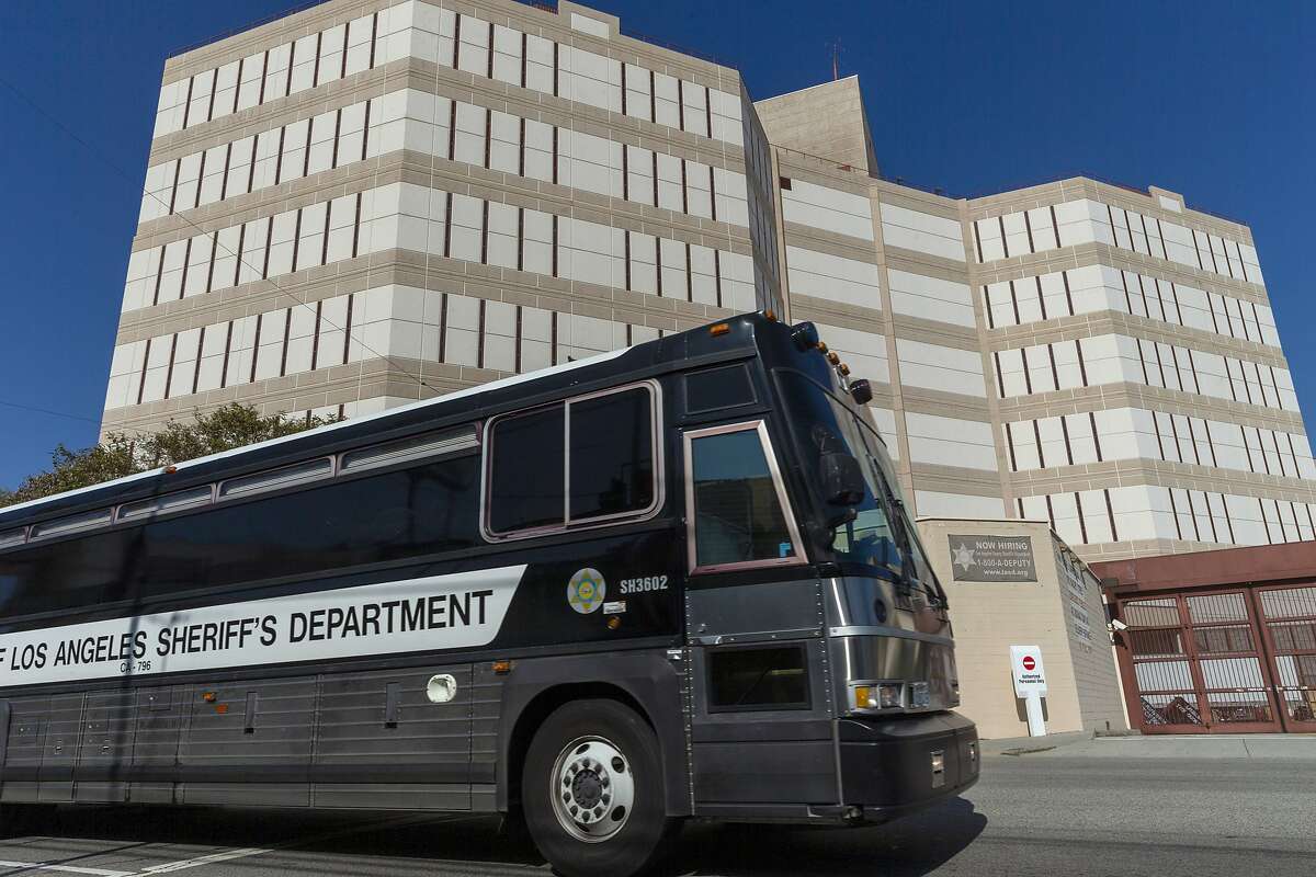 A Los Angeles County Sheriff's Department prisoner transportation bus leaves the Twin Towers Correctional Facility in Los Angeles on Wednesday, April 1, 2020. California is planning to release within days as many as 3,500 inmates who were due to be paroled in the next two months as it tries to free space in cramped prisons in anticipation of a coronavirus outbreak, state officials said Tuesday. (AP Photo/Damian Dovarganes)