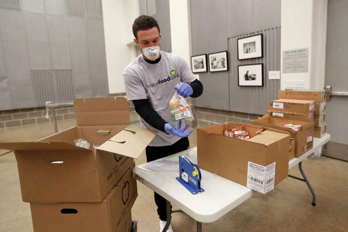 Houston Astros Alex Bregman packaging sustainable kids meals at the Houston Food Bank, in Houston,Friday, April 10, 2020. Bregman launched his FEEDHOU, a $1 million fundraising campaign to help feed Houston-area residents during the coronavirus pandemic.