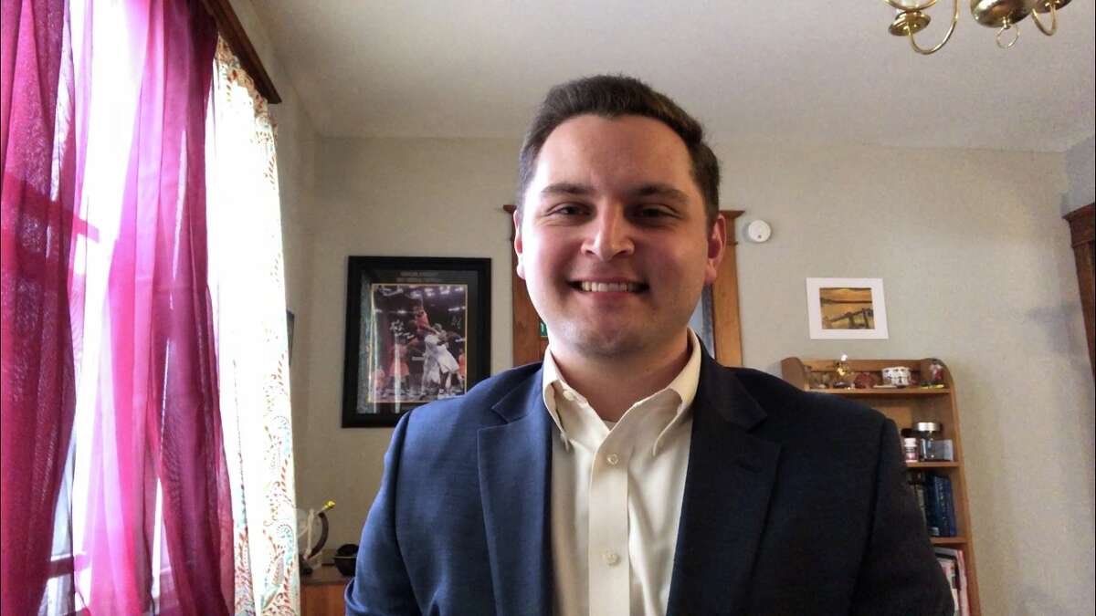 Jesse MacWilliam, a sports anchor and reporter with Spectrum News Albany, broadcasts from home.