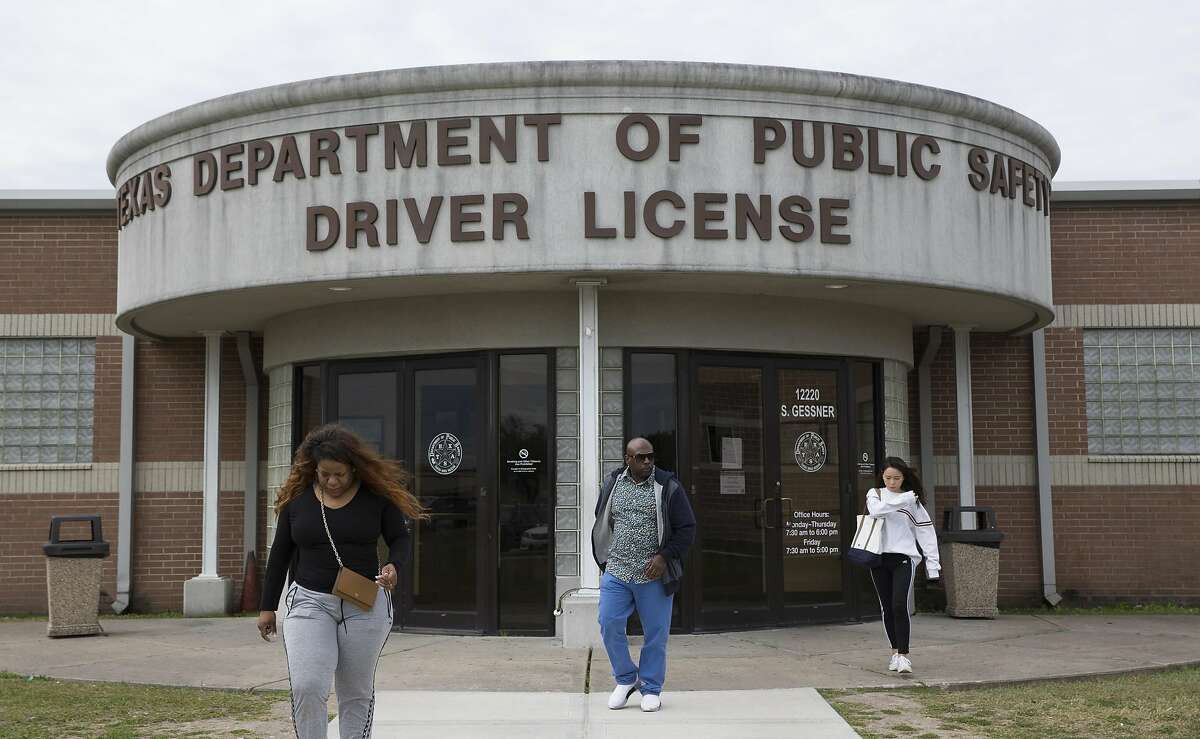 People leaving and coming in to the Texas Department of Public Safety Driver License Mega Center on South Gessner Road on Wednesday, Jan. 30, 2019, in Houston.