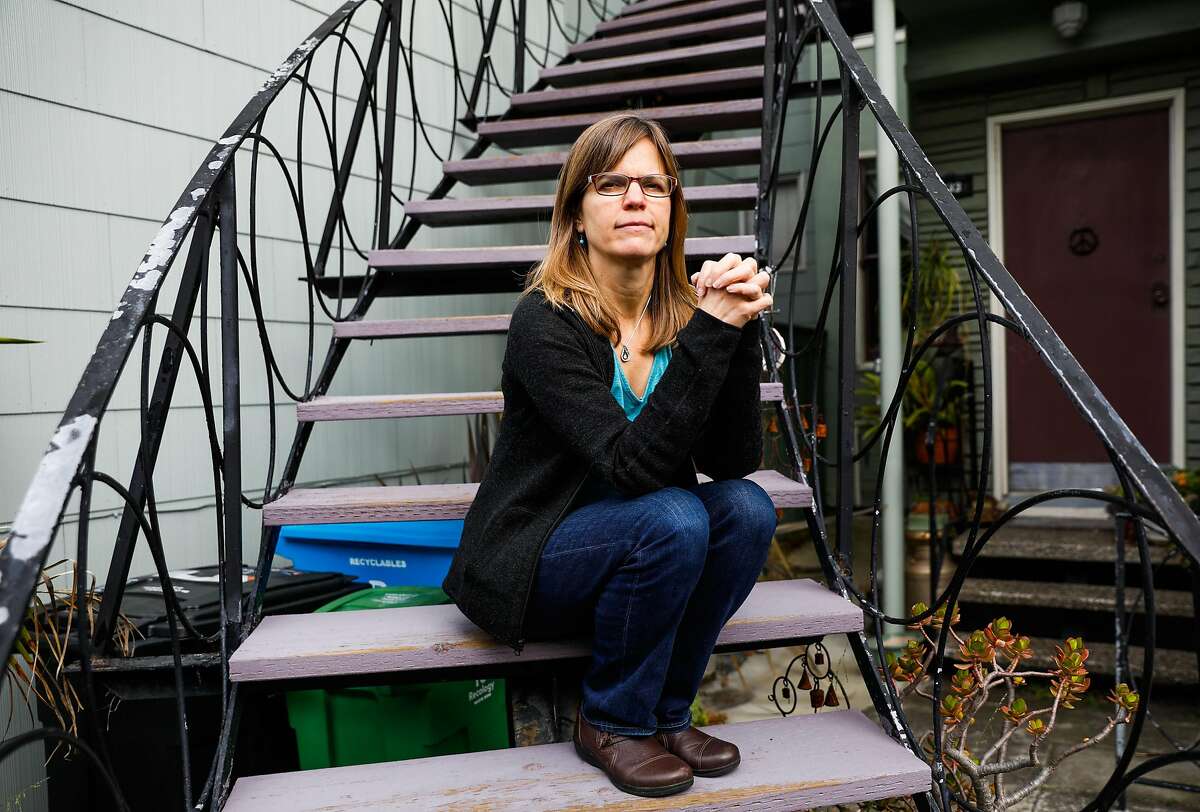 Elizabeth Brooks, the daughter of palliative care patient Robert Lewis poses for a photograph outside her home on Thursday, April 9, 2020 in San Francisco, California.