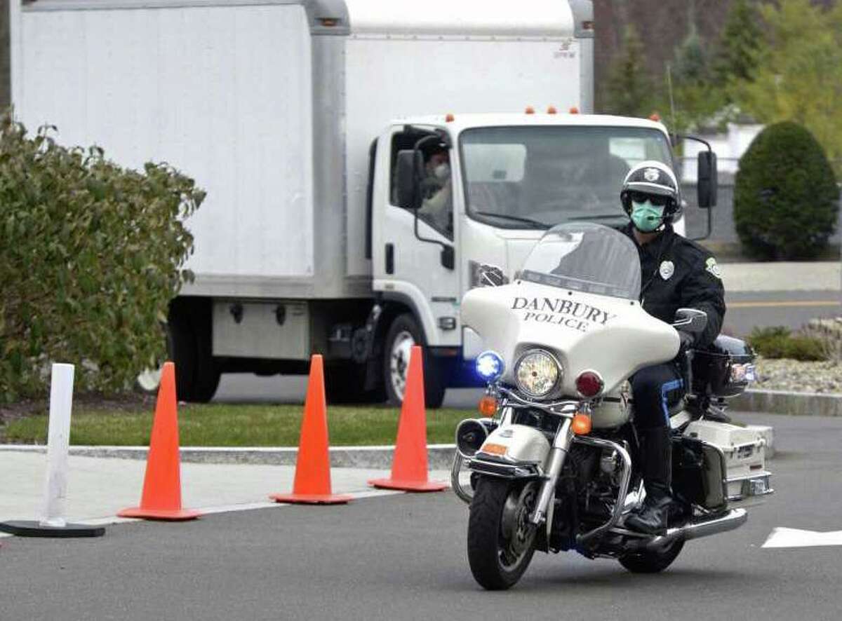 Ezra Zimmerman, of Ridgefield, owner of EZ Moving, is given a police escort to Danbury Hospital from I-84. Zimmerman drove to Kentucky to pick up four used ventilators that Danbury Hospital had purchased. Tuesday, April 7, 2020, in Danbury, Conn.