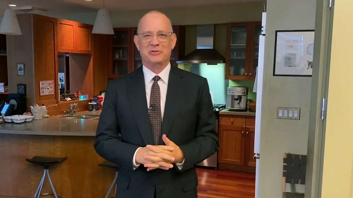 In this screengrab provided by NBC, Tom Hanks delivers his monologue while hosting "Saturday Night Live" from his home in Los Angeles, on Saturday, April 11, 2020. “Saturday Night Live” tried its first “quarantine version" of the comedy show, with Hanks, one of the first celebrities to disclose he had the coronavirus, Coldplay singer Chris Martin and the comedy show's entire cast phoning in with jokes from home. (NBC via AP)