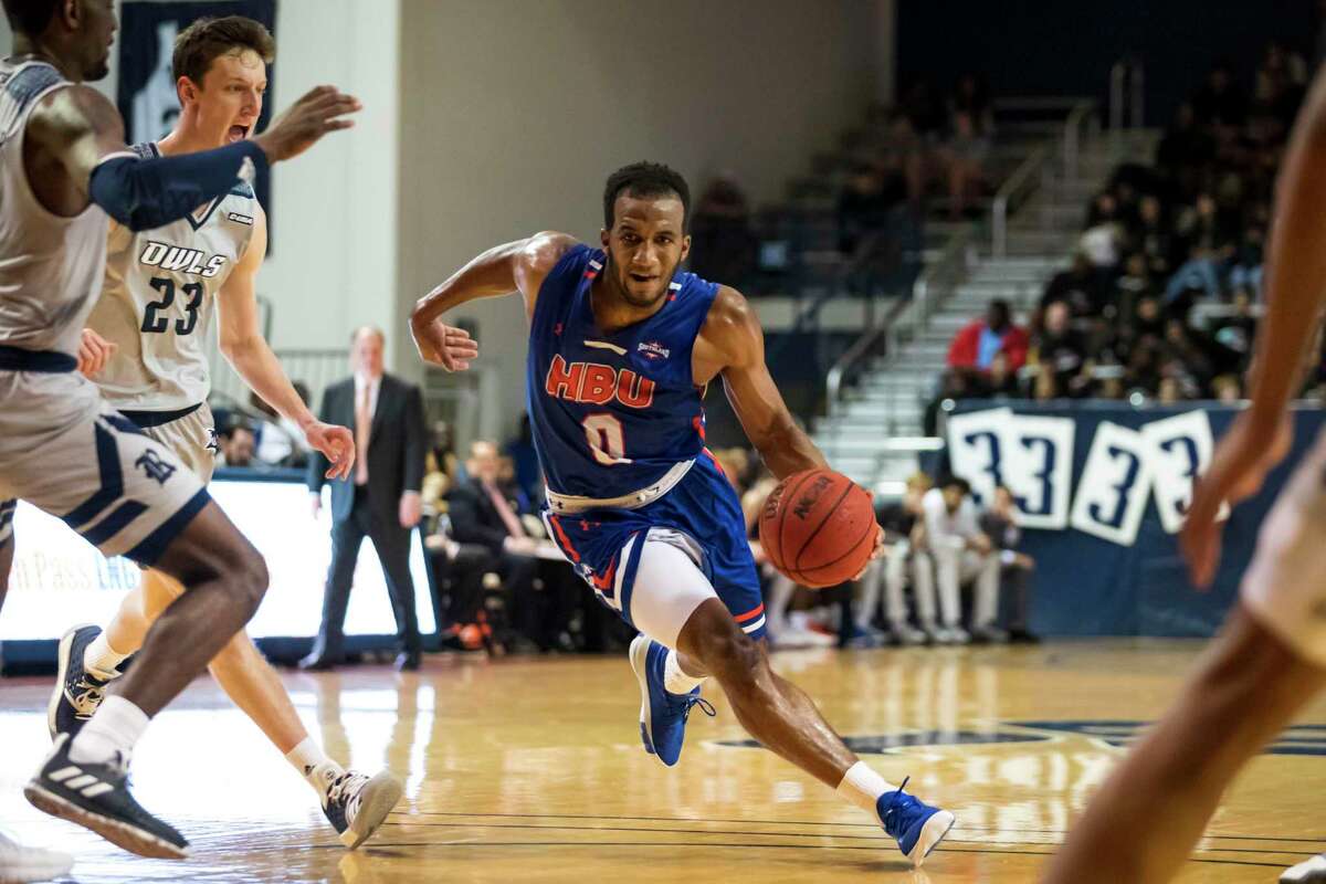 Houston Baptist guard Ian Dubose (0) drives from the top of the key in the first half of a college basketball game Saturday, Dec 14, 2019, in Houston.