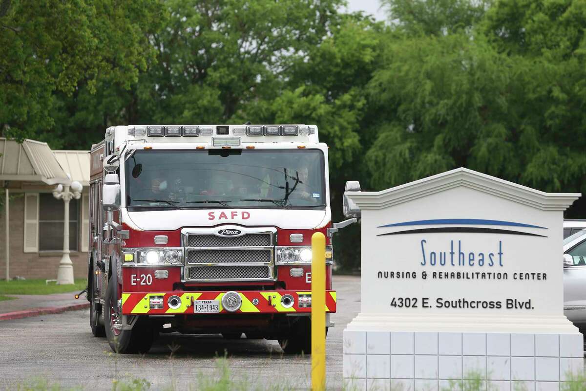 A San Antonio Fire Department truck leaves the Southeast Nursing and Rehabilitation Center on April 3. The fire department has had to make frequent emergency runs to the facility to take residents to the hospital; more than 70 of the 84 residents have tested positive for COVID-19 and 14 have died. More than 25 employees at the nursing home also have tested positive, officials say.