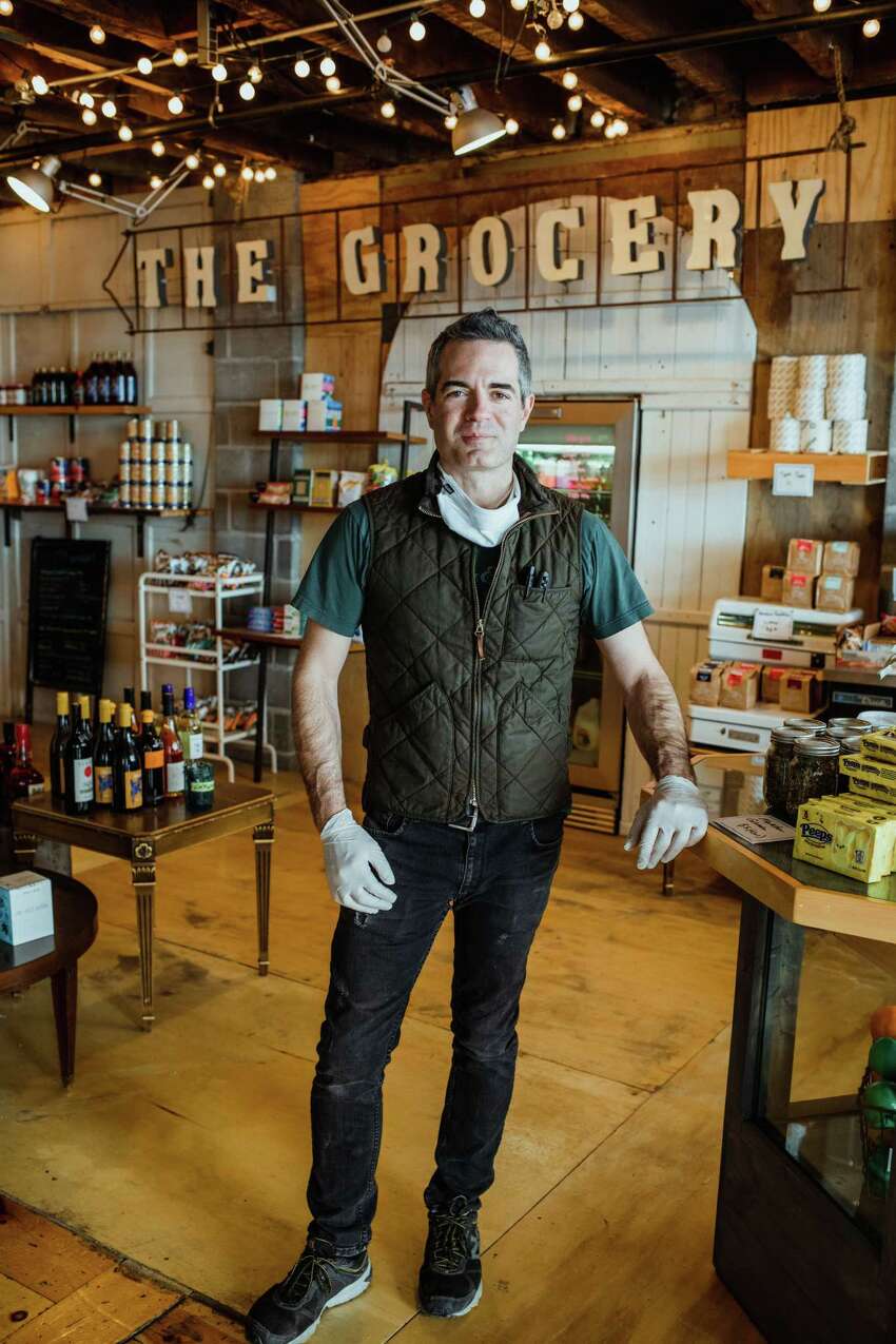 Vic Christopher, owner of Clark House Hospitality in Troy, shown in April of this year in an area of the company's Little Peck's cafe that has been turned into a small market. Little Pecks is within the larger Clark House building, at 207-217 Broadway. (Photo by Konrad Odhiambo.)