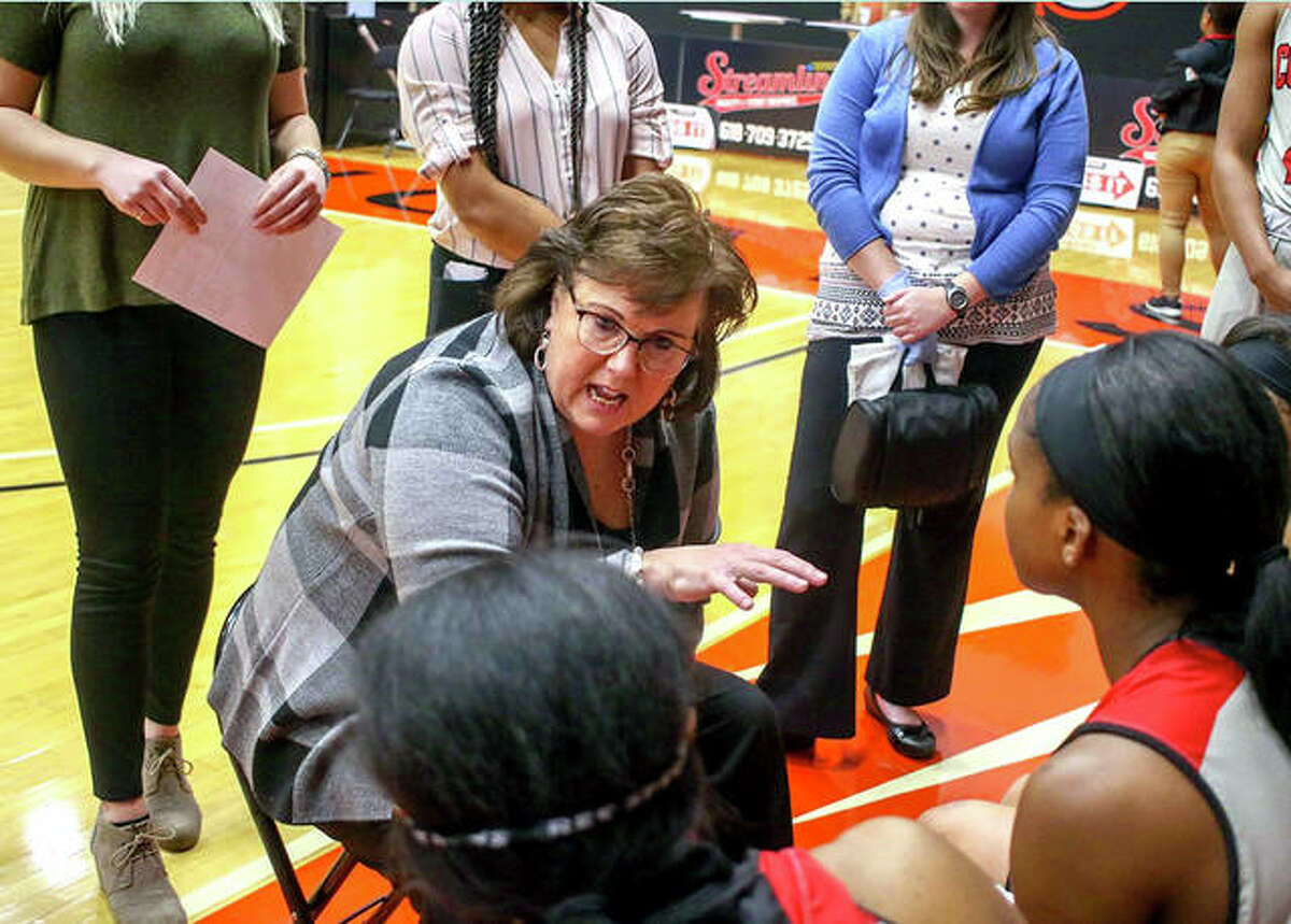 SIUE coach Paula Buscher talks to her Cougars during a timeout during a regular-season game inside the Vadalabene Center.