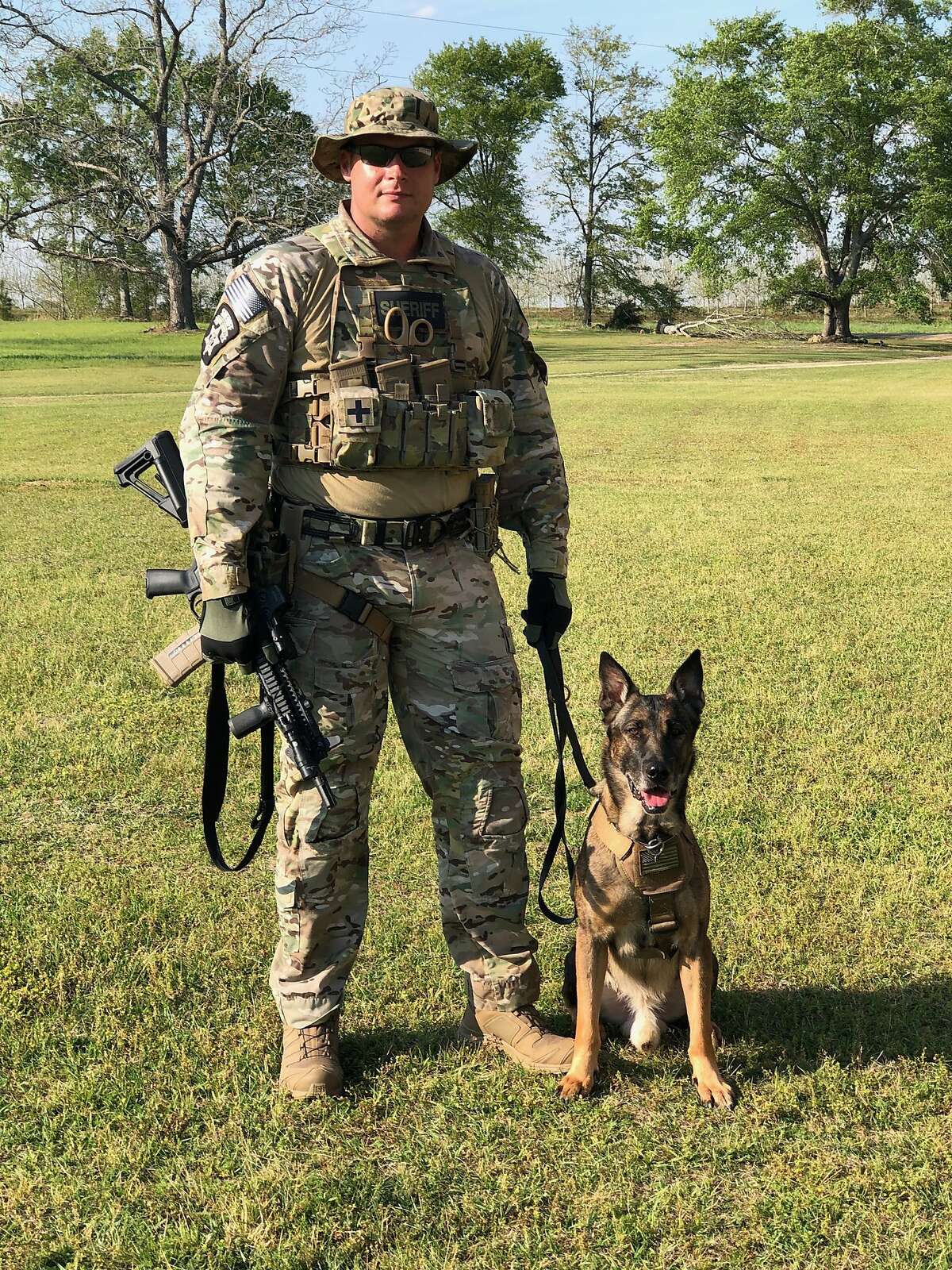 Former A's catcher Rob Bowen works with K9 partner Boedha, who is now retired.