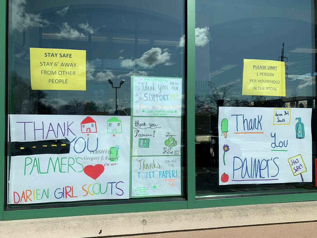 Darien Girl Scouts created thank you signs for Palmer's front window. These were made by Lauren Devens and Cynthia Clough's eighth grade Girl Scout troop 50469. That troop also made signs for Post 53.