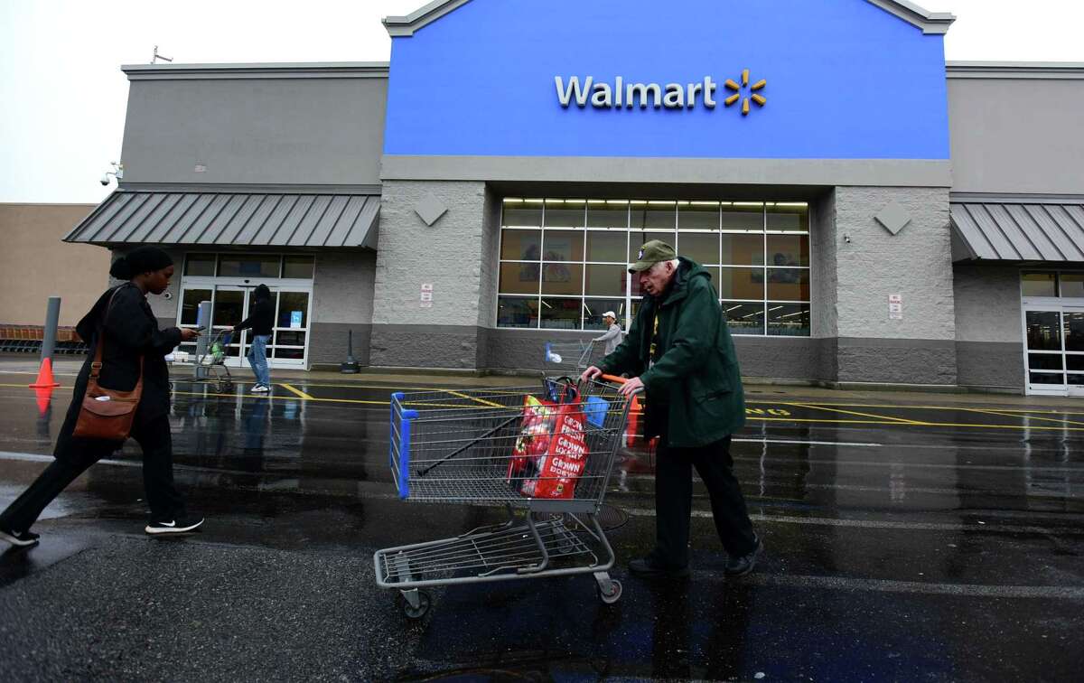 Shoppers flock to Walmart Friday, March 2020, in Norwalk, Conn.