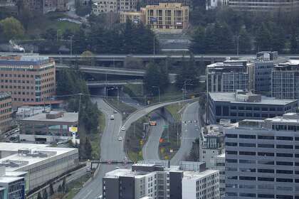 Nearly empty on- and off-ramps to Interstate 5 are seen at the end of Mercer Street, viewed from the roof of the Space Needle on March 26. Most people in the usually bustling city were off the streets Thursday during a statewide stay-at-home mandate.