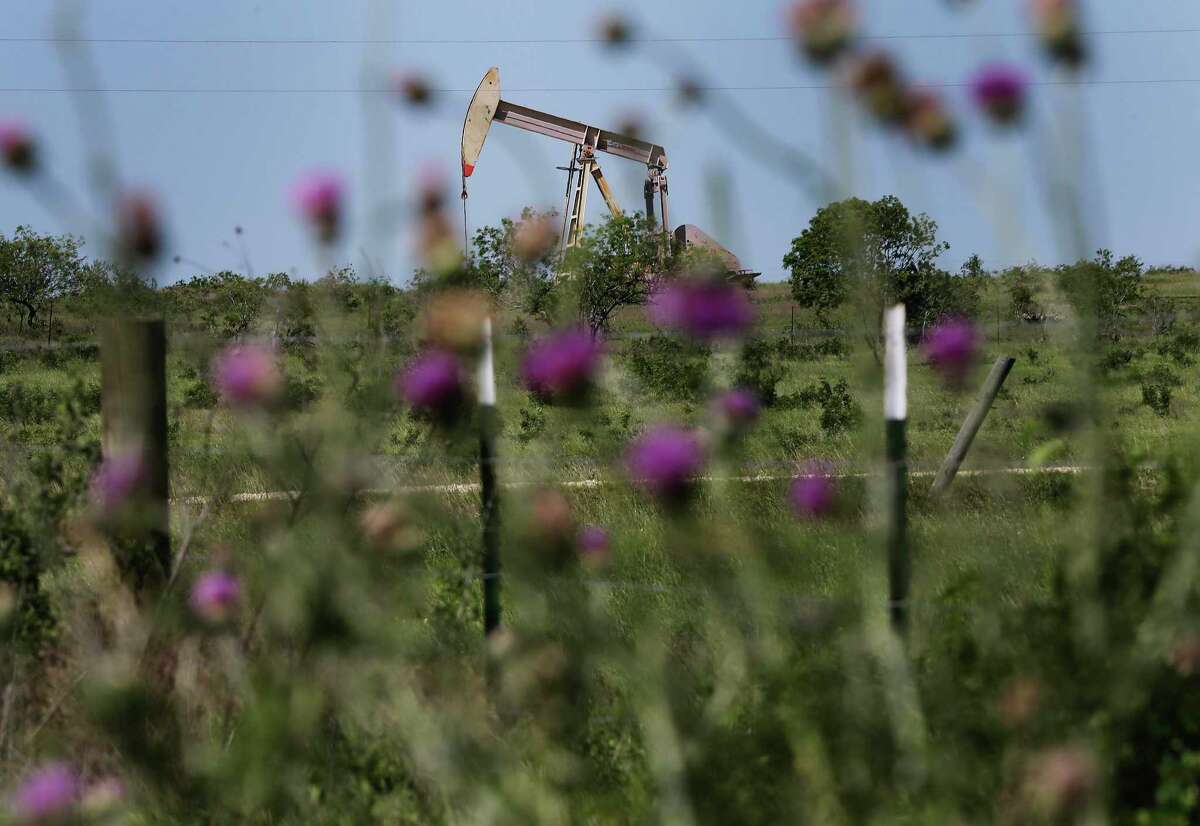 A pump jack operates in a field near Poth, Texas on Monday, Apr. 13, 2020. Small oil producers are struggling and are facing a plan to cut production by 20 percent if approved by the Railroad Commission. The commission is scheduled to vote on the matter on Tuesday.