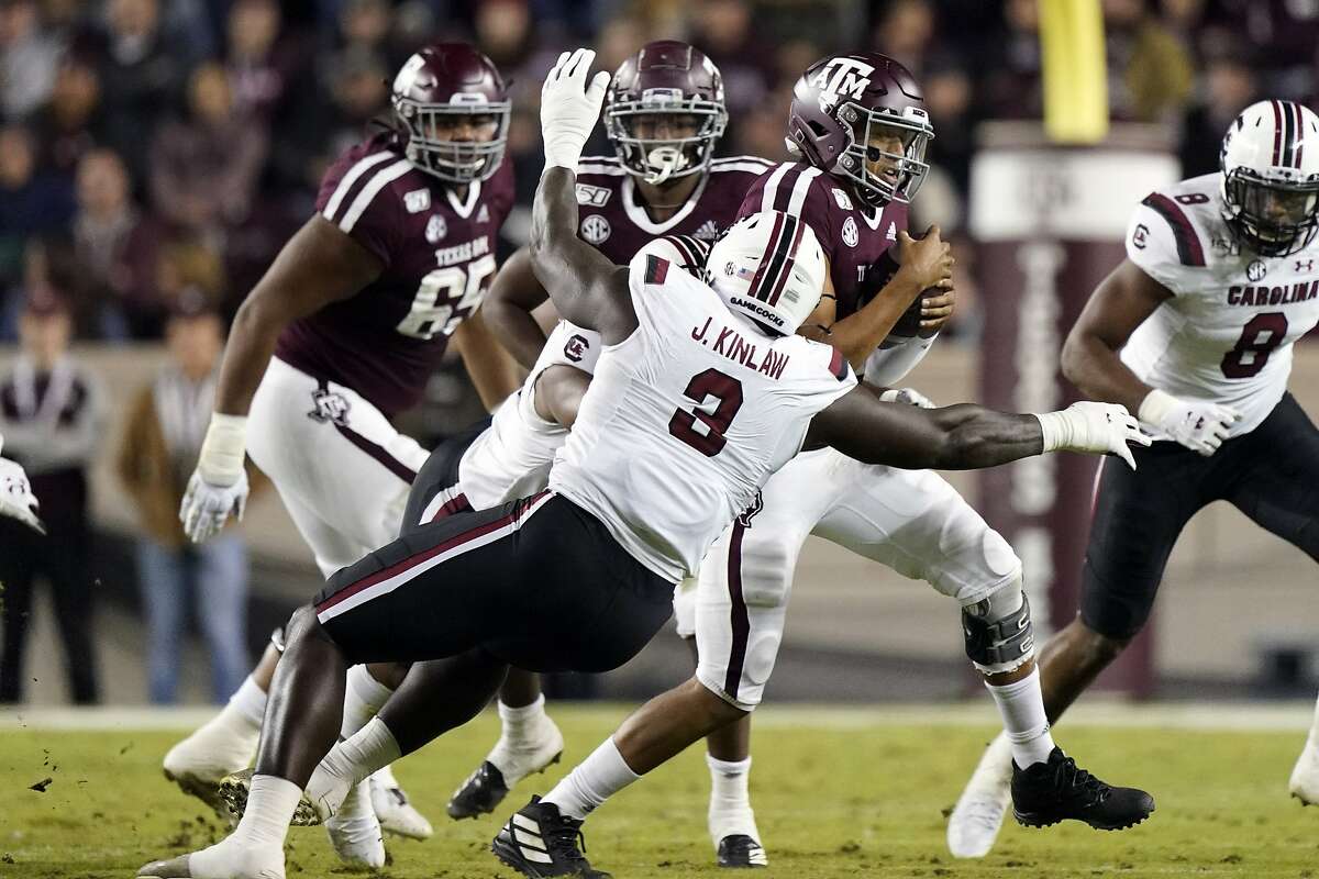 South Carolina State's Javon Kinlaw (3) tackles Texas A&M quarterback Kellen Mond during the second quarter of an NCAA college football game Saturday, Nov. 16, 2019, in College Station, Texas. (AP Photo/David J. Phillip)
