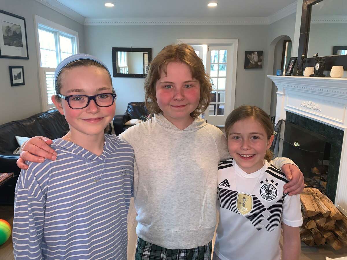 Anna, Sophie and Carla Lenschow, sisters from Old Greenwich, raised more than $2,000 for Save the Children.